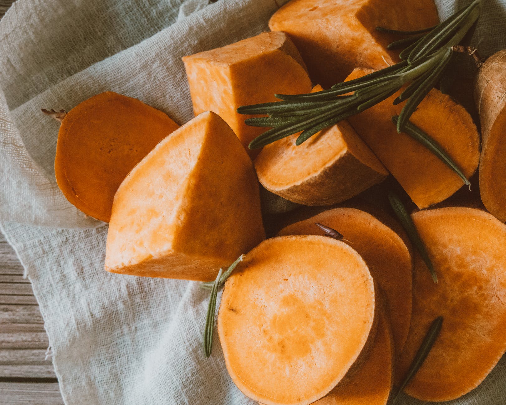 close up photograph of chopped sweet potatoes on a cloth