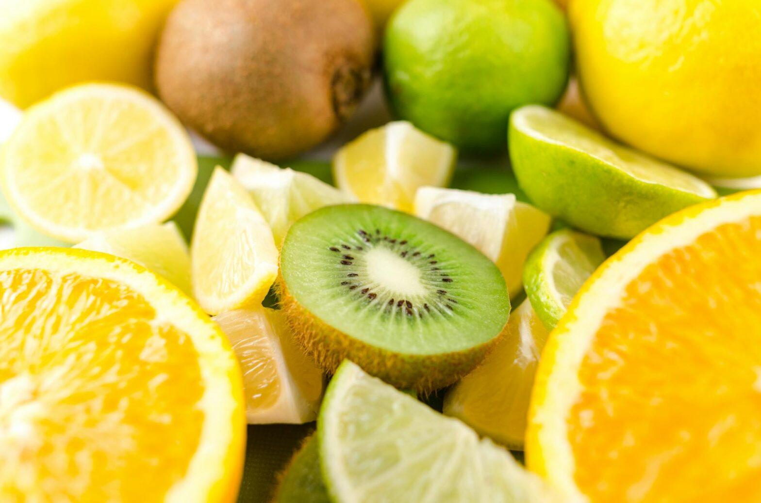 photo of slices of kiwi lime and orange fruits